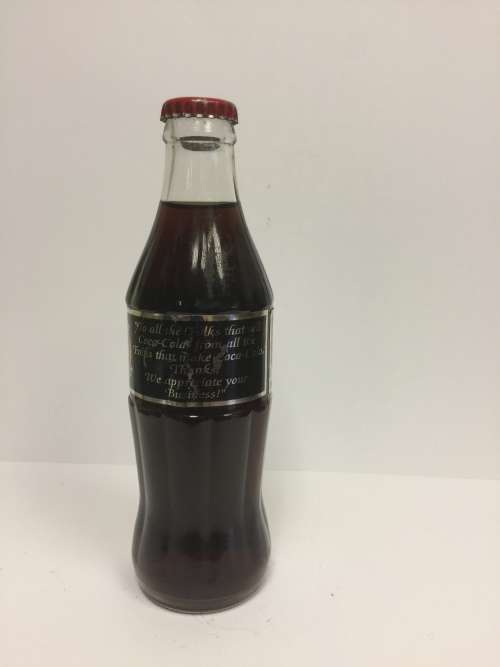VINTAGE and RARE SEALD Commemorative Coca Cola bottle with foil label "thanking the seller"