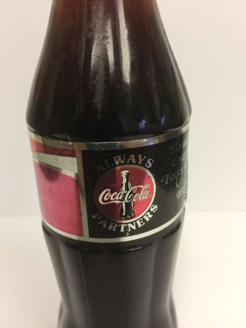 VINTAGE and RARE SEALD Commemorative Coca Cola bottle with foil label "thanking the seller"