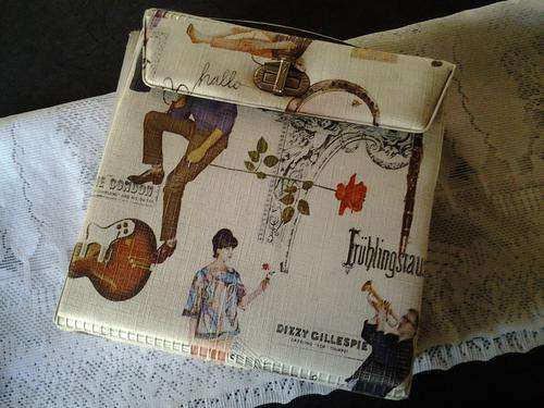A vintage seven single Lp holder with 24 seven singles - lovely vintage collectors piece.