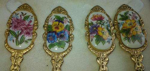 A set of raised  cake spoons each with its own unique floral design & filigree raised detailling.