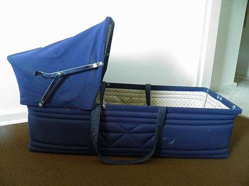VERY HANDY BABY CARRIER/COT in MIDNIGHT BLUE in very good condition  with foldable top