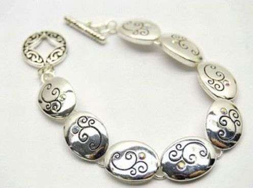 FLORAL SCROLLS ON OVAL DISCS - TOGGLE BRACELET