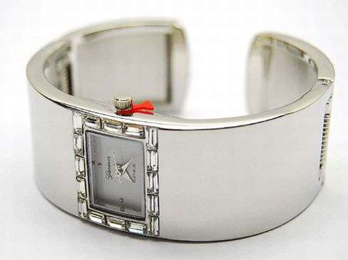 SQUARE FACE - GENEVA QUARTZ WATCH ON A HIGHLY POLISHED METAL BROAD BAND - CUFF WATCH