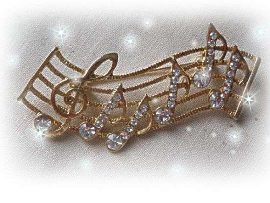 SYMPHONY BROOCH WITH AUSTRIAN CRYSTALS IN GOLD COLOR
