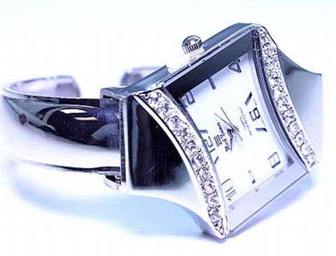 OBLONG HIGHLY POLISHED GENEVA LADIES CUFF WATCH WITH CRYSTAL TRIMMINGS ON BEZEL