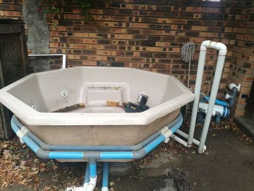 Large Jacuzzi with plumbing. No pumps. Good condition.