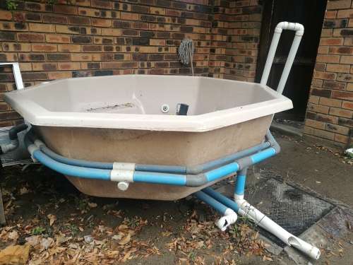 Large Jacuzzi with plumbing. No pumps. Good condition.