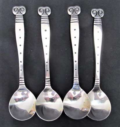 A set of four 'Capricorn' children's spoons by Carrol Boyes