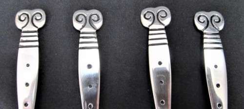 A set of four 'Capricorn' children's spoons by Carrol Boyes