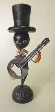 Vintage bottle opener: man with top hat and guitar