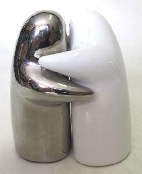 A set of salt and pepper shakers, an embracing couple