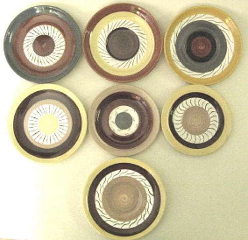 Seven saucers by Clementina van der Walt
