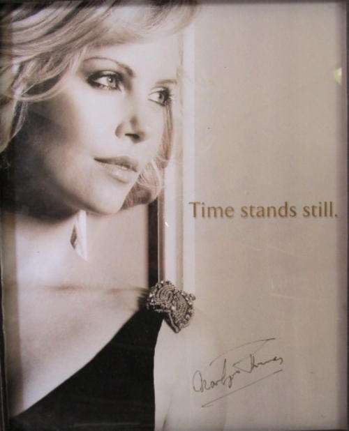 Framed autographed photo of Charlize Theron