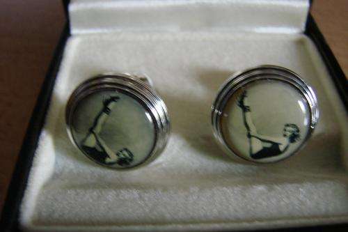Lovely old fashioned cufflinks with pictures of 1950's lady in costume on front