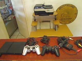 Sony Playstation 2  + Cables + 2 Remote Controls
