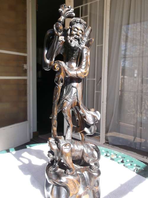 Oriental hard wood figurine, large.