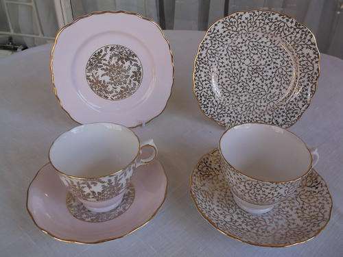 Two English porcelain Trios. Pink & white with gold leaf pattern