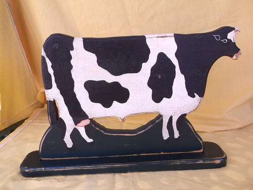 Cow made out of wood for kitchen.