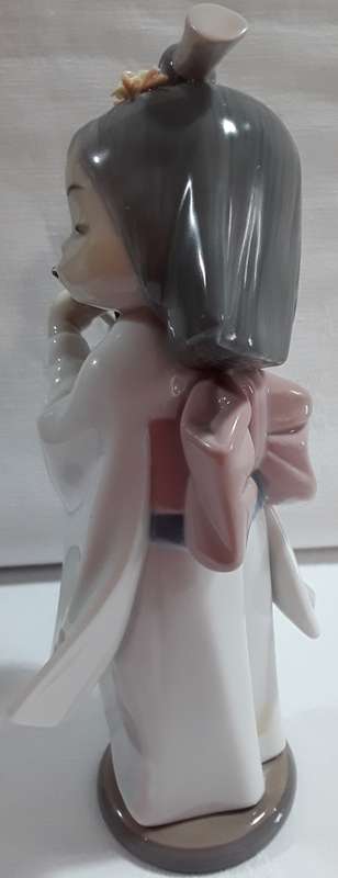 Lladro Girl playing Flute