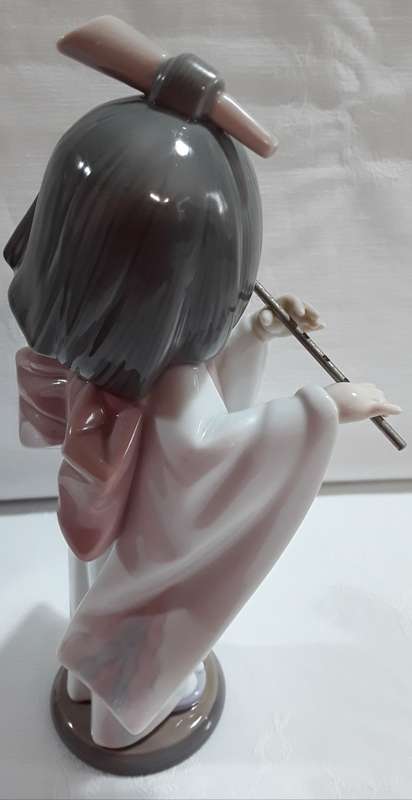 Lladro Girl playing Flute