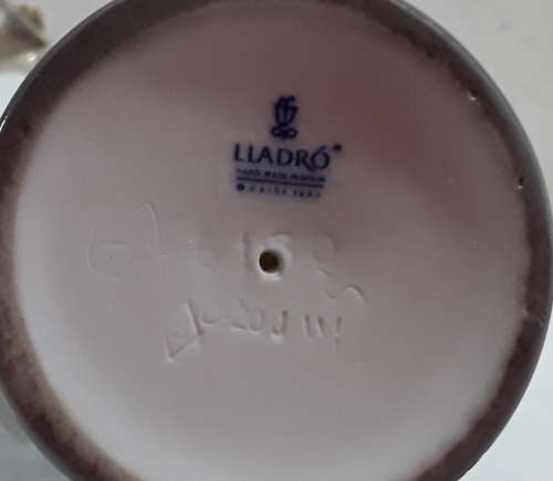 Lladro Girl playing Flute