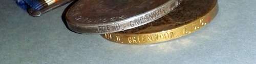 A Mutt and Jeff pair of WWI medals, awarded to PTE H. GREENWOOD D.S.C