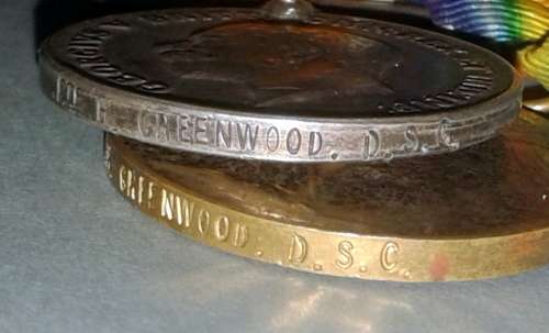 A Mutt and Jeff pair of WWI medals, awarded to PTE H. GREENWOOD D.S.C