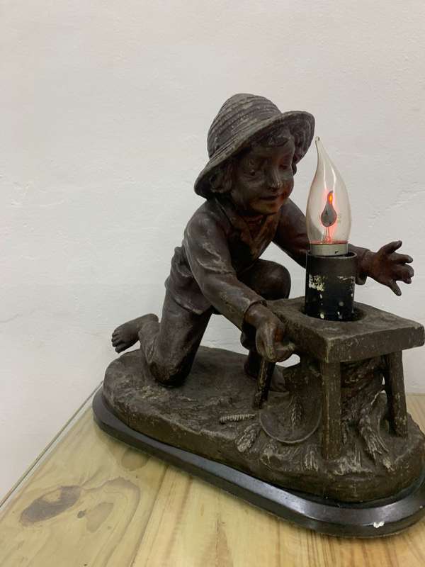 Bronze Boy Holding Lamp