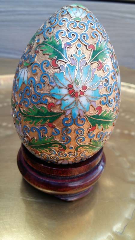Beautiful brass enameled ornate oriental Cloisonne Egg on carved wooden stand. 10cm