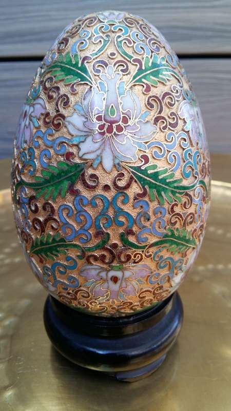 Beautiful brass enameled ornate oriental Cloisonne Egg on carved wooden stand. 14cm