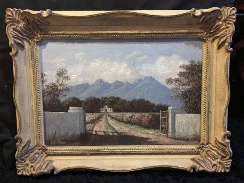 An incredible framed oil on canvas of a cottage scene in an antique frame signed A.L.Kleu