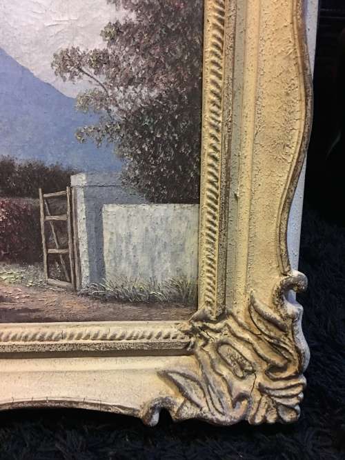 An incredible framed oil on canvas of a cottage scene in an antique frame signed A.L.Kleu