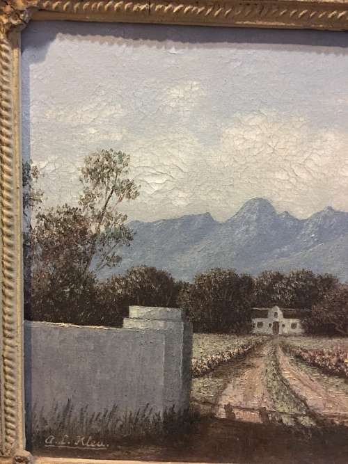 An incredible framed oil on canvas of a cottage scene in an antique frame signed A.L.Kleu