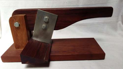 A Stunning Vintage Black Wood Bilton Cutter, From Knysna with vintage green felt underneath.
