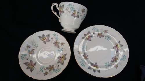 Beautiful Vintage Paragon "ENCHANTMENT" Trio with gold trim and Pastel floral design. c1957