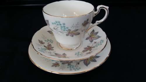 Beautiful Vintage Paragon "ENCHANTMENT" Trio with gold trim and Pastel floral design. c1957