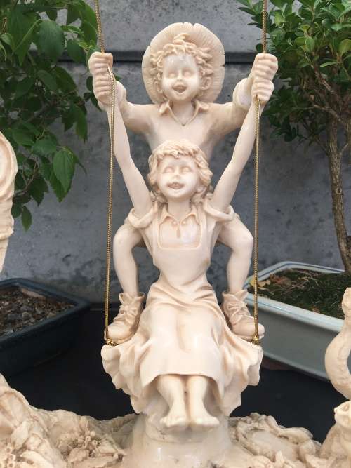 WOW !!! STUNNING LARGE RESIN FAIRYTALE STYLE ORNAMENT OF KIDS SWINGING IN A TREE