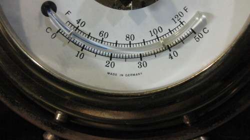 STUNNING GERMAN STOCKBURGER SHIPS WHEEL BAROMETER ON A WOODEN BASE IN FULL WORKING ORDER