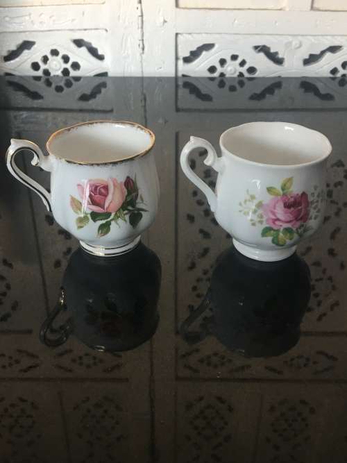 2 Rose Tea Cups By  Royal Albert " Anniversary Rose & American Beauty " 1 cup small chip