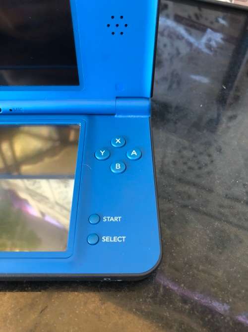 NINTENDO DSi XL GAME CONSOLE IN ORIGINAL BOX WITH CHARGER AND MANUAL FULL WORKING ORDER WITH 2 GAMES