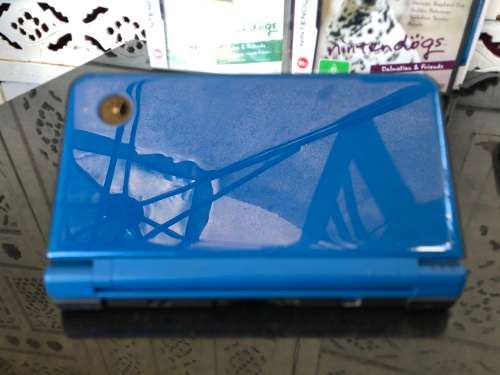 NINTENDO DSi XL GAME CONSOLE IN ORIGINAL BOX WITH CHARGER AND MANUAL FULL WORKING ORDER WITH 2 GAMES