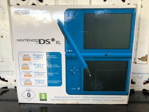 NINTENDO DSi XL GAME CONSOLE IN ORIGINAL BOX WITH CHARGER AND MANUAL FULL WORKING ORDER WITH 2 GAMES