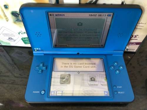 NINTENDO DSi XL GAME CONSOLE IN ORIGINAL BOX WITH CHARGER AND MANUAL FULL WORKING ORDER WITH 2 GAMES