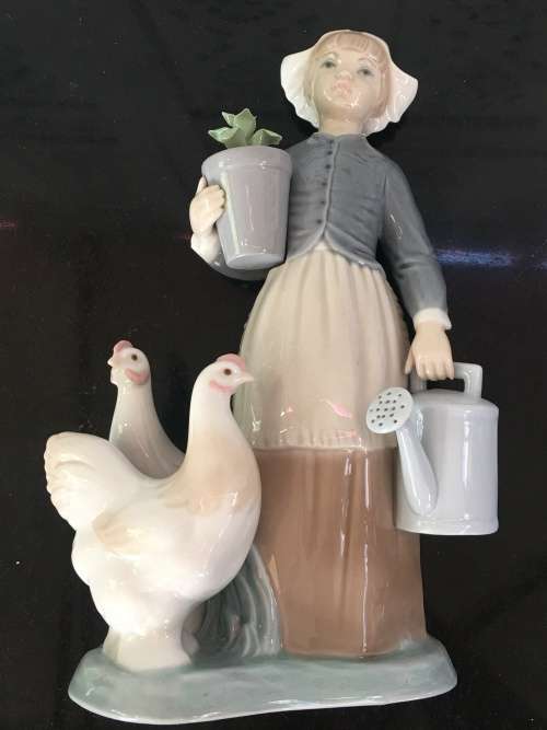 A LLADRO Porcelain Figurine, Country Girl with Plant & Water Can in Hands Ducks at feet.