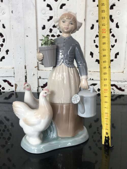 A LLADRO Porcelain Figurine, Country Girl with Plant & Water Can in Hands Ducks at feet.