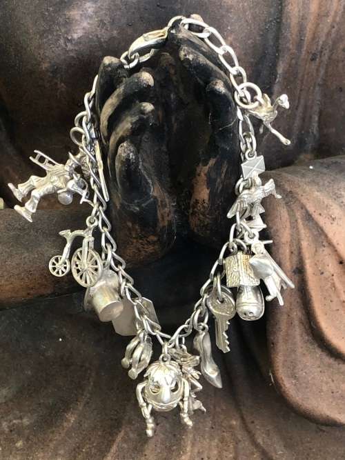 STUNNING STERLING SILVER CHARM BRACELET - WITH 15 OLD RARE CHARMS - CLEARLY MARKED - 33.52g