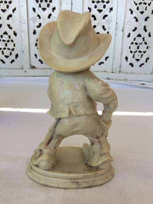 Delightful Carved Resin Boy Cowboy Figurine