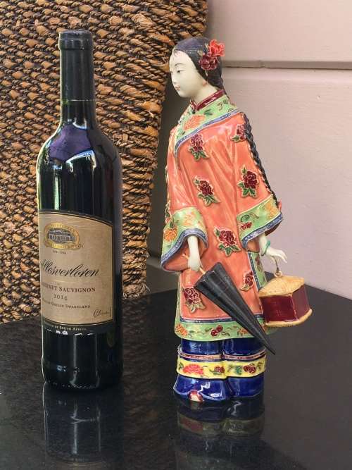 A Signed Chinese Shiwan female figurine hand sculpted and decorated. 30.5 cm tall