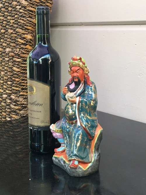 Vintage Signed Chinese Shiwan male figurine hand sculpted and decorated.