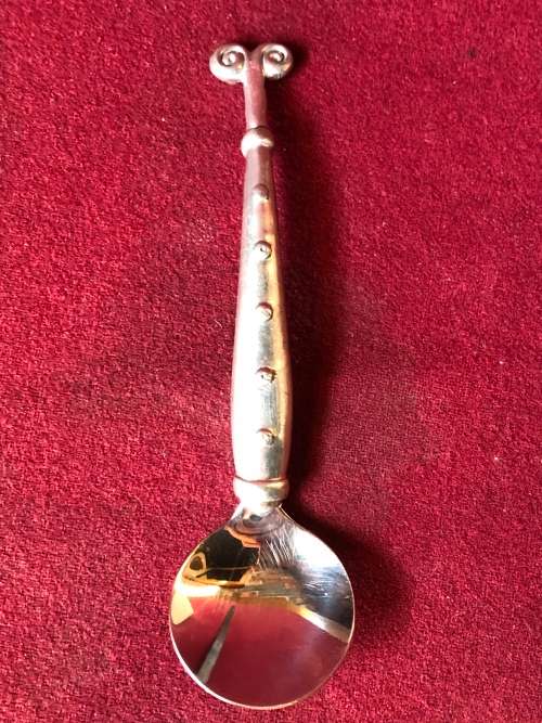CARROL BOYES (1954 - 2019) FUNCTIONAL ART ARIES PATTERN SUGAR SPOON - CLEARLY MARKED